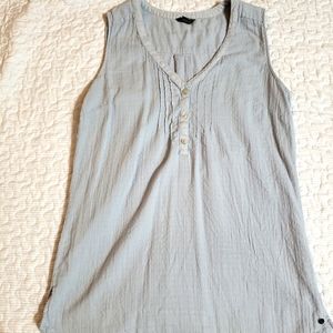 Light blue sleeveless blouse w/ button detail